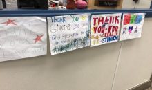 Photograph of hand-drawn thank you signs for school cafeteria workers from students.